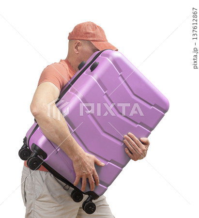 Man carrying, hugging suitcase. Funny tourist in cap holding large hardshell carry-on, isolated on Man carrying, hugging suitcase. Funny tourist in cap holding large hardshell carry-on, isolated on 137612867
