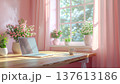 Remote working, spring. serene workspace with laptop on wooden desk, surrounded by pink flowers and sunlight streaming through window 137613186