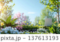 Remote working, spring. laptop sits in vibrant garden with blooming flowers and lush greenery under clear blue sky 137613193