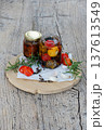Marinated cheese with tomatoes, garlic and rosemary in oil 137613549