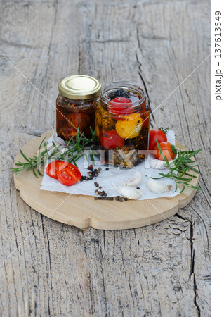 Marinated cheese with tomatoes, garlic and rosemary in oil 137613549