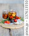 Marinated cheese with tomatoes, garlic and rosemary in oil 137613550
