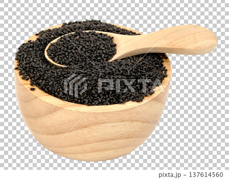 Sweet basil seeds in a small wooden bowl with a wooden spoon isolated. Raw black sabja seeds for healthy drinks and dessert topping. High angle view of natural organic ingredient. Sweet basil seeds in a small wooden bowl with a wooden spoon isolated. Raw black sabja seeds for healthy drinks and dessert topping. High angle view of natural organic ingredient. 137614560