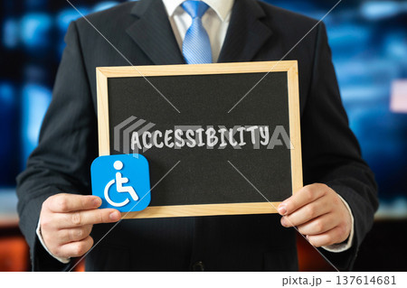 Board with the word Accessibility and an icon of a person with a disability, symbolizing inclusion, equal access, social responsibility, human rights, diversity, support, and accessibility for all. Board with the word Accessibility and an icon of a person with a disability, symbolizing inclusion, equal access, social responsibility, human rights, diversity, support, and accessibility for all. 137614681