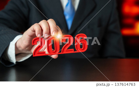 The year 2026 in the hand of a businessman. Business plans and economic forecasts. 137614763