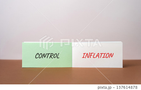 Control inflation concept. Balancing prices, costs, and purchasing power through financial policy, budgeting, and market regulation. Inscription on notebook 137614878