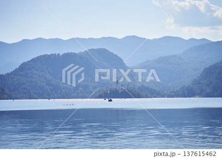 Scenic panoramic view of Lake Bled with the island church and mountains in the background Scenic panoramic view of Lake Bled with the island church and mountains in the background 137615462