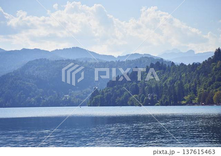 Scenic panoramic view of Lake Bled with the island church and mountains in the background 137615463