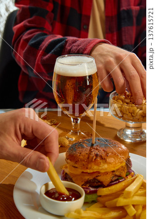 Burger fries and beer casual pub dinner concept Burger fries and beer casual pub dinner concept 137615721