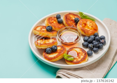 Homemade pancakes with blueberries and syrup Homemade pancakes with blueberries and syrup 137616142