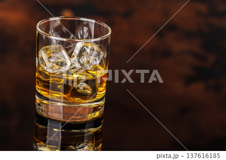 Glass of whiskey with ice 137616185