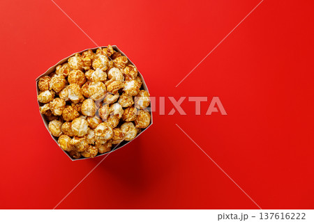 Popcorn bucket on bright red background 137616222