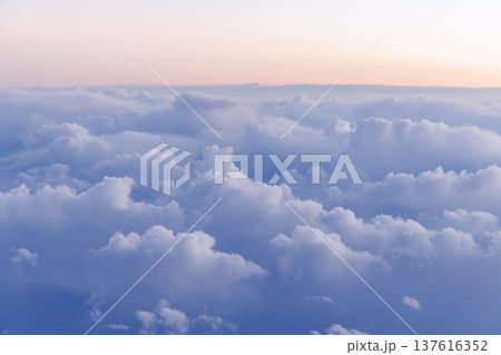 Sunset above the clouds from airplane Sunset above the clouds from airplane 137616352