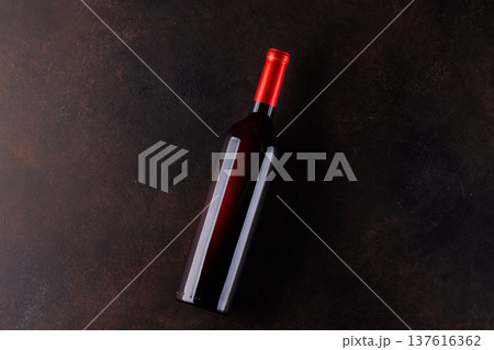 Red wine bottle on stone table top view Red wine bottle on stone table top view 137616362