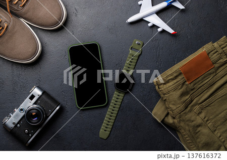 Safari clothing and gear with smartphone 137616372