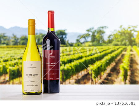 Wine bottles mockup in sunlit vineyard Wine bottles mockup in sunlit vineyard 137616383