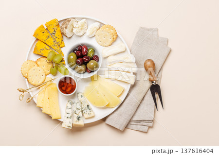 Cheese board with olives grapes and honey 137616404