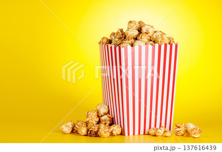 Popcorn bucket on bright yellow background 137616439