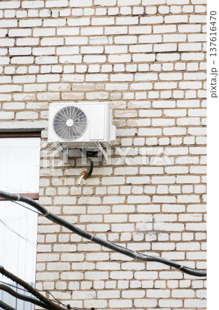 air conditioning on facade of building, air cooling in hot weather.  137616470