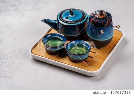 Asian tea ceremony set with teapot and cups 137617318