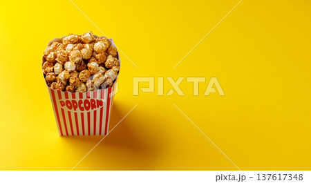 Popcorn bucket on bright yellow background 137617348