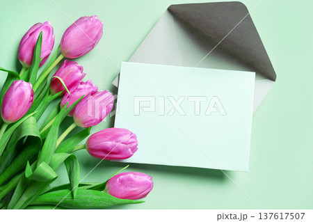 Pink tulips with blank card. Spring Floral Mockup for Greeting Cards or Invitation. Pink tulips with blank card. Spring Floral Mockup for Greeting Cards or Invitation. 137617507