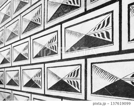 Black and white renaissance letter sgraffito pattern of the facade. Black and white renaissance letter sgraffito pattern of the facade. 137619099