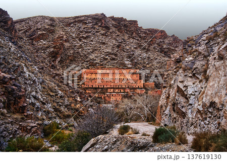 Traditional village kasbah built into rocky atlas mountains Traditional village kasbah built into rocky atlas mountains 137619130