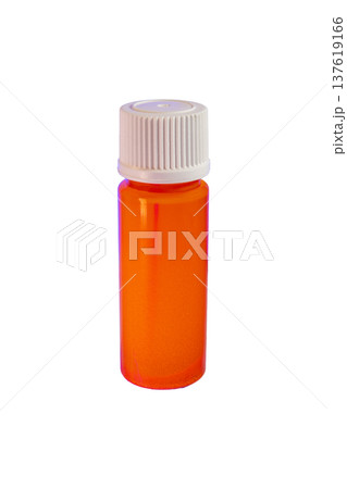 Cylindrical laboratory bottle containing bright fluorescent orange chemical solution 137619166