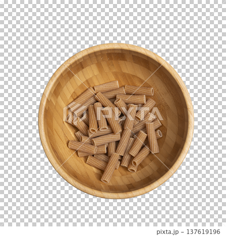 whole wheat rigatoni in a wooden bowl 137619196