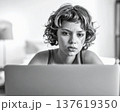 Young woman working on a laptop grayscale image in retro style 137619350