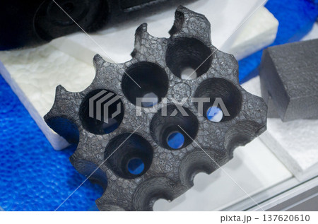 Technical component made of expanded polypropylene EPP. Black model of dense and lightweight EPP, expanded polypropylene material, universal foam. New modern technologies. Industrial manufacturing 137620610