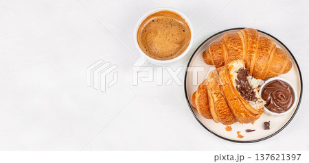 Croissants with chocolate spread and coffee breakfast top view 137621397
