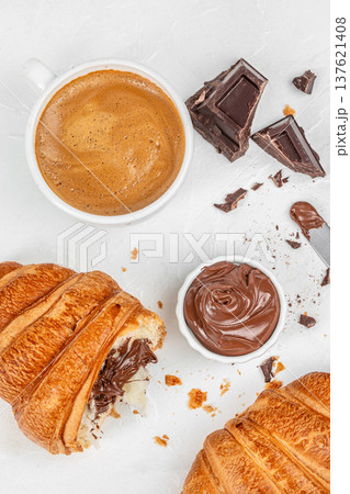 Chocolate croissants with coffee and chocolate spread breakfast flat lay Chocolate croissants with coffee and chocolate spread breakfast flat lay 137621408