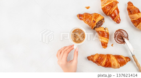 Croissants with chocolate spread and espresso breakfast top view 137621414