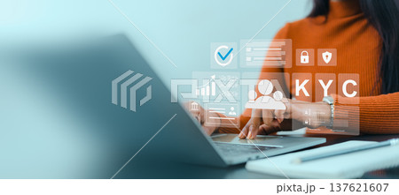 KYC digital identity verification process.  Cybersecurity and data privacy protection. Remote identity verification for corporate. Businesswoman using laptop for KYC digital identity verification. 137621607
