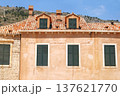 Historical part of city. Rooftop and windows old house. Wooden shutters on windows. Summer in Croatia, Dubrovnik. 137621770