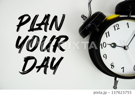 Plan Your Day text with alarm clock flat lay on white background Plan Your Day text with alarm clock flat lay on white background 137623755