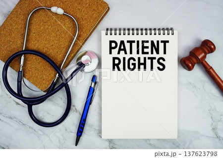 Patient Rights text written on notepad with stethoscope and gavel on marble background Patient Rights text written on notepad with stethoscope and gavel on marble background 137623798
