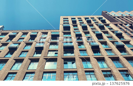 Architecture and real estate, modern residential apartment building with large panoramic windows Architecture and real estate, modern residential apartment building with large panoramic windows 137625976