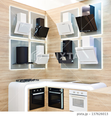 Gas and electric stoves and hoods in store 137626013