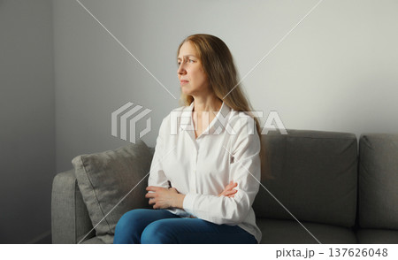 Pensive woman thinks looks out the window, thoughtful girl suffering from depression at home Pensive woman thinks looks out the window, thoughtful girl suffering from depression at home 137626048