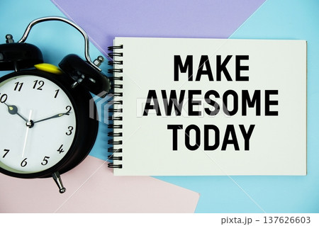 Make Awesome Today text written on notepad with alarm clock flat lay on multicolor pastel background Make Awesome Today text written on notepad with alarm clock flat lay on multicolor pastel background 137626603