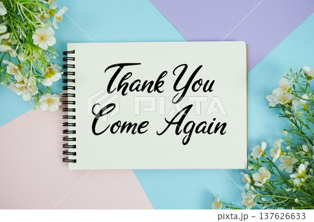 Thank You text written on notepad with flowers decorations flat lay on multicolor pastel background 137626633