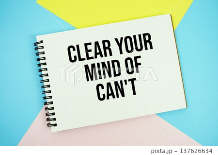 Clear Your Mind of Can't text written on notepad flat lay on multicolor pastel background 137626634
