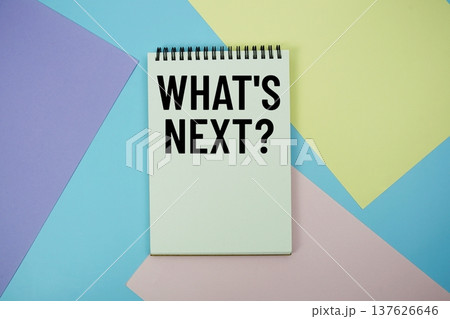 What's Next? text written on notepad flat lay on multicolor pastel background 137626646