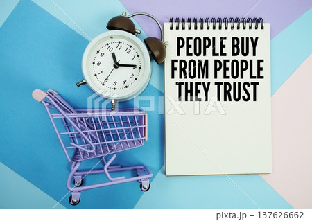 People Buy from People They Trust text written on notepad with alarm clock and trolley shopping cart People Buy from People They Trust text written on notepad with alarm clock and trolley shopping cart 137626662