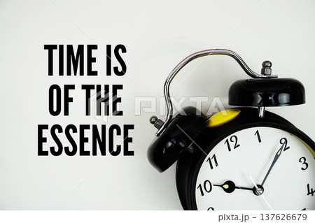 Time Is Of The Essence text with alarm clock flat lay on white background Time Is Of The Essence text with alarm clock flat lay on white background 137626679