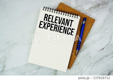 Relevant Experience text written on notepad with pen on marble background 137626712