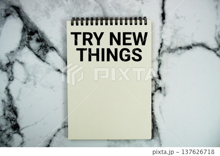 Try New Things text written on notepad flat lay on marble background 137626718